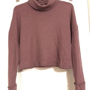 Cropped turtle neck shirt.
